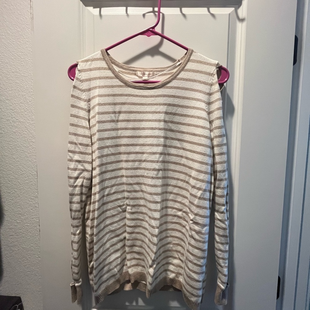 Skies Are Blue pink striped long sleeve with criss crosses along both sleeves